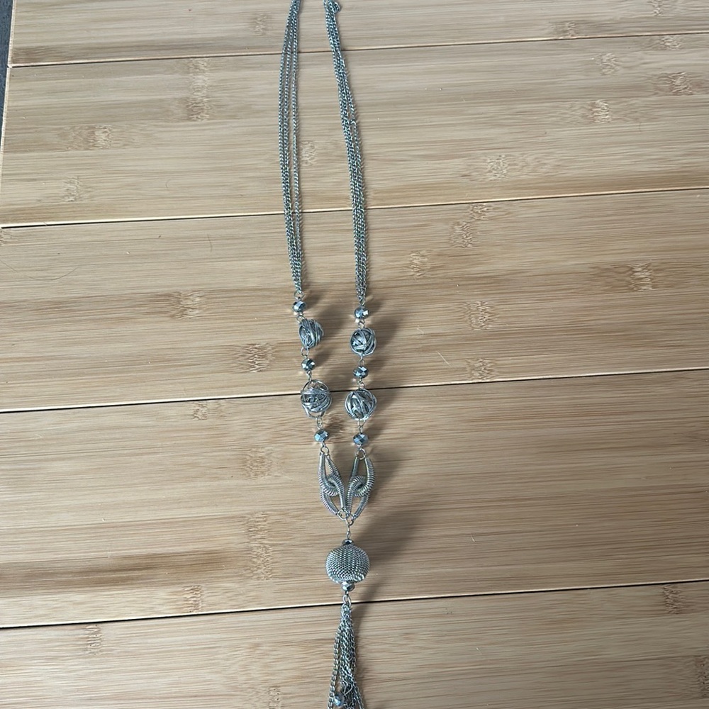 Long silver necklace with crystals